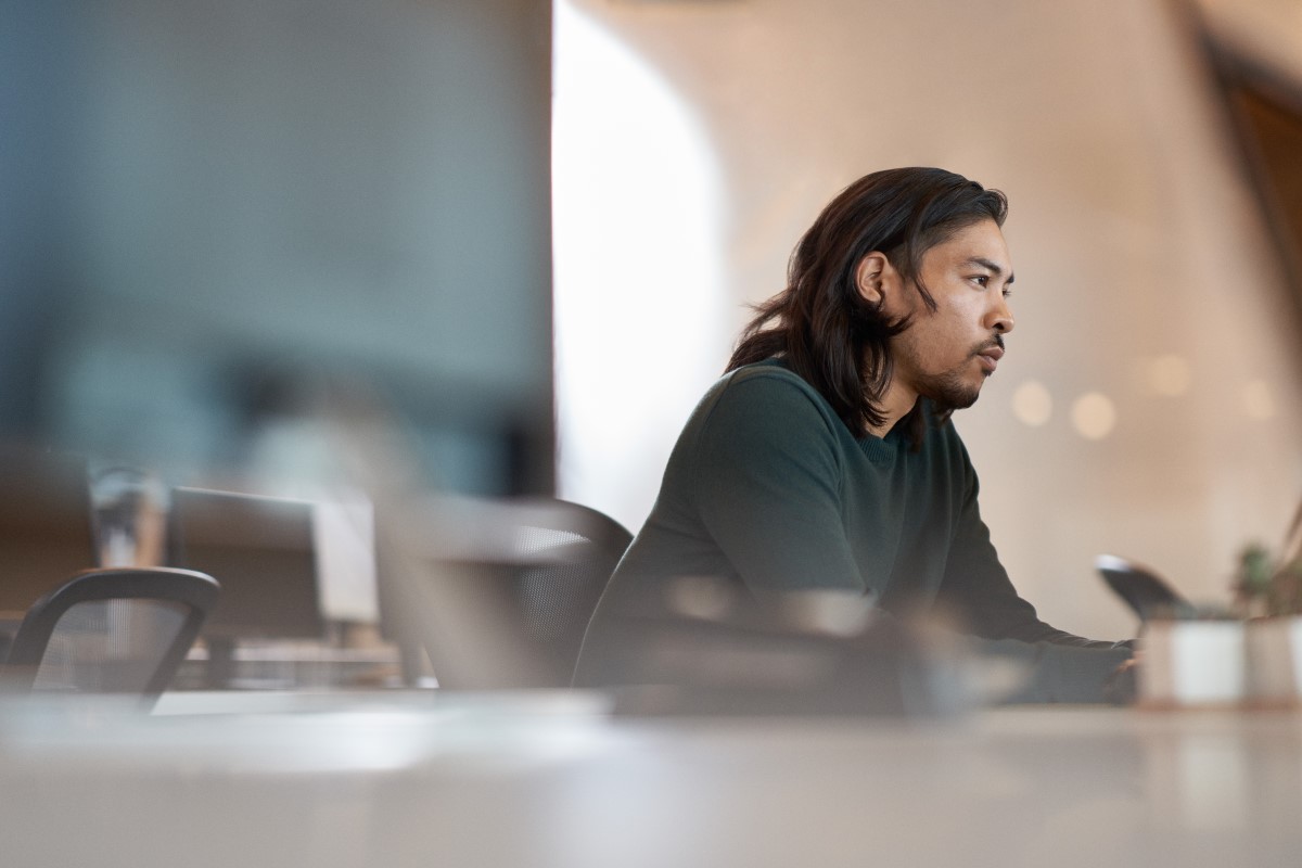 Office worker in focused work with a neutral facial expression