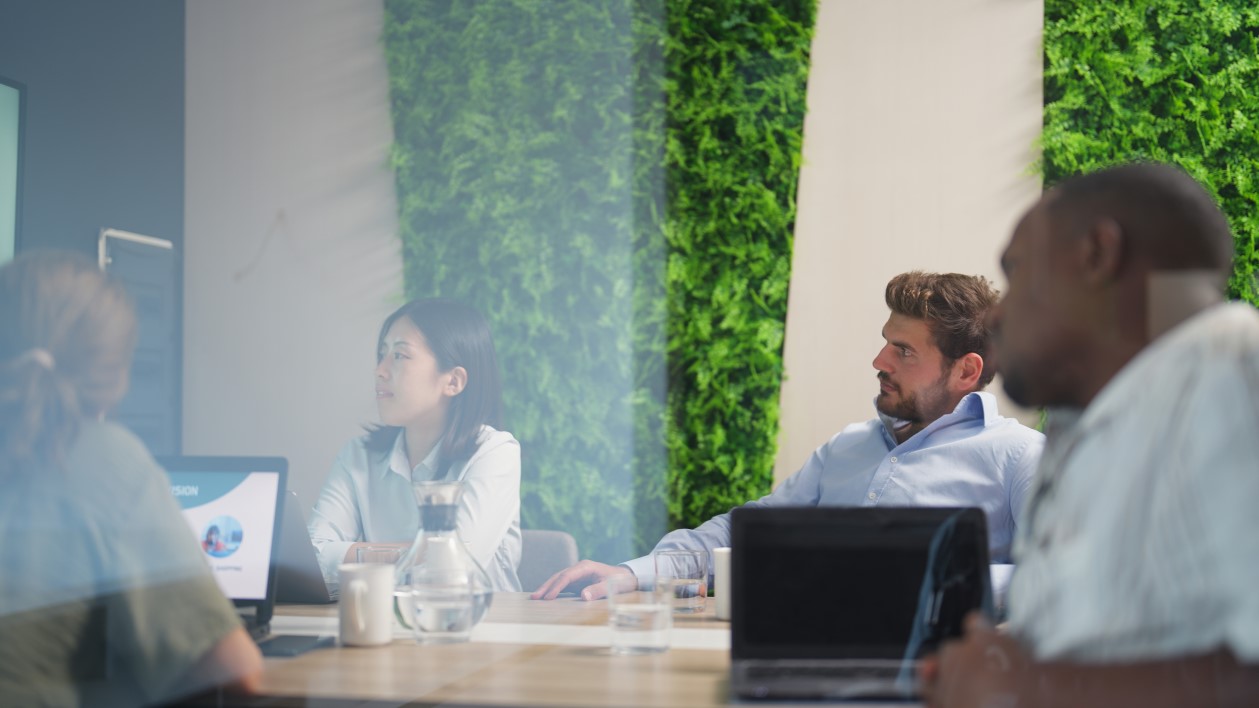 Group of business people are having a business meeting in a meeting room in a modern office working space