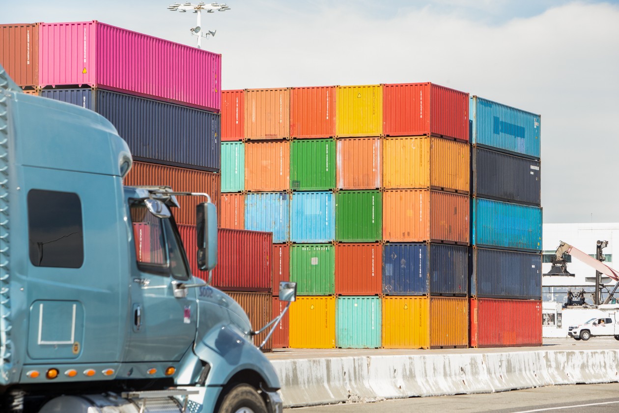 Tighter shot of colorful shipping containers; environmental shot