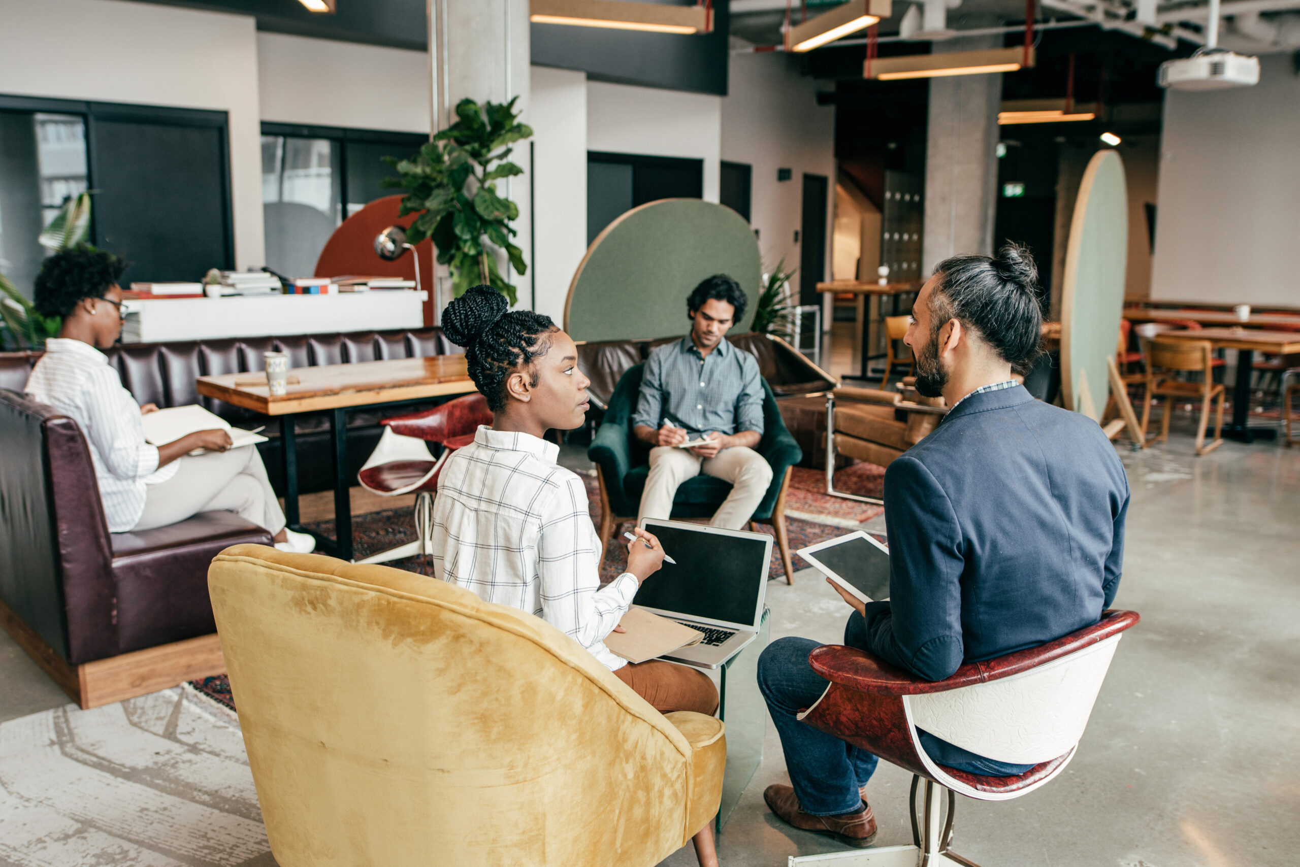 Entrepreneurs at work in a common area of a creative workplace