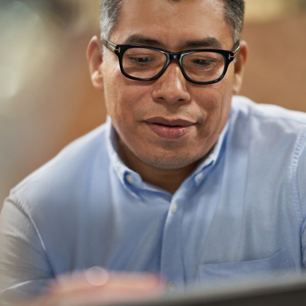 A person working on a laptop.