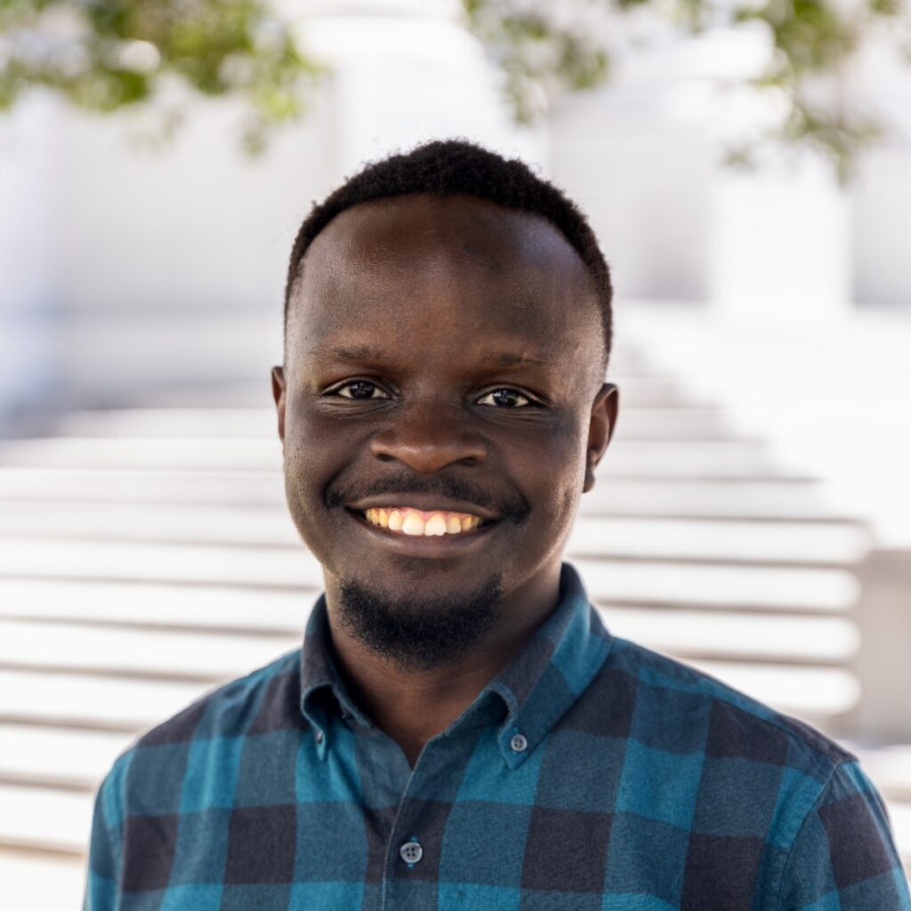 headshot photo of Collins Munyendo