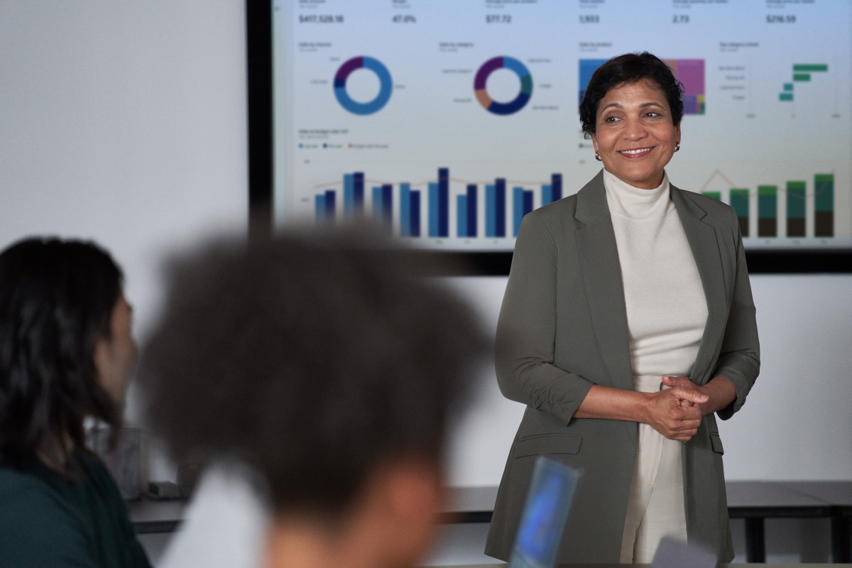 CISO (chief information security officer) presents to the board of executives on security topics in a conference room setting