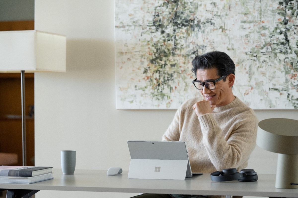 Hybrid employee working in home office on portable device
