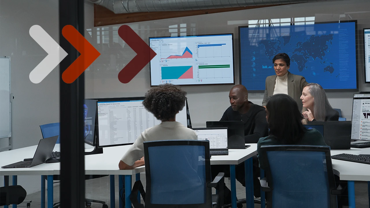 A group of security professionals gather around a computer
