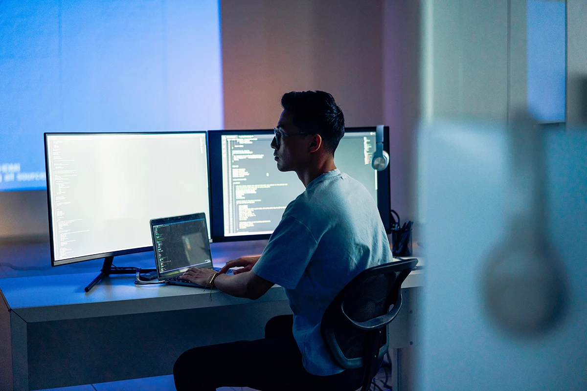 Computer developer working at night in office