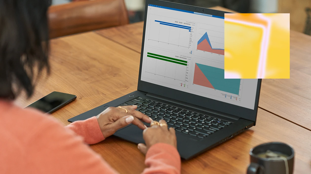 A person at a desk using a laptop