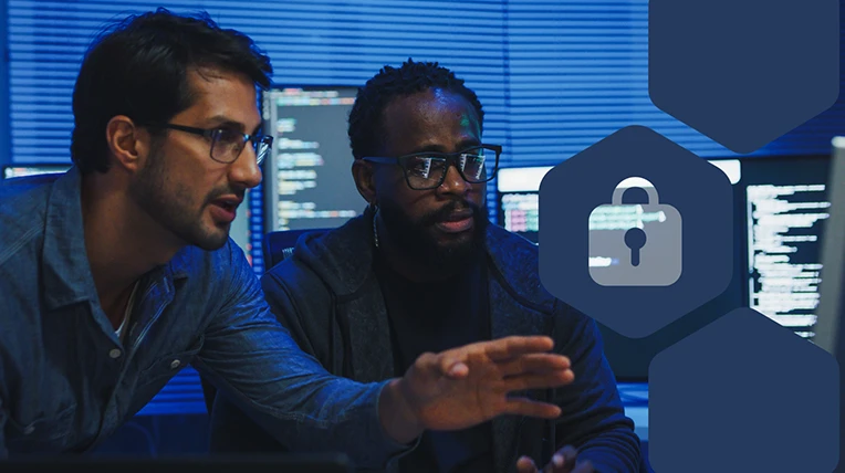 Two men looking at multiple monitors