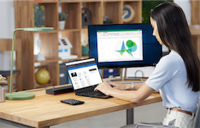 a person standing in front of a computer